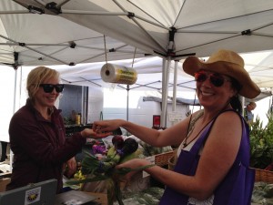 Cybele buying onions at the market